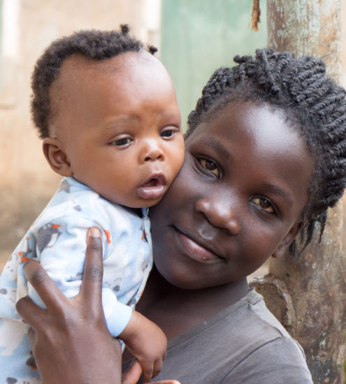 Uganda mother holding child