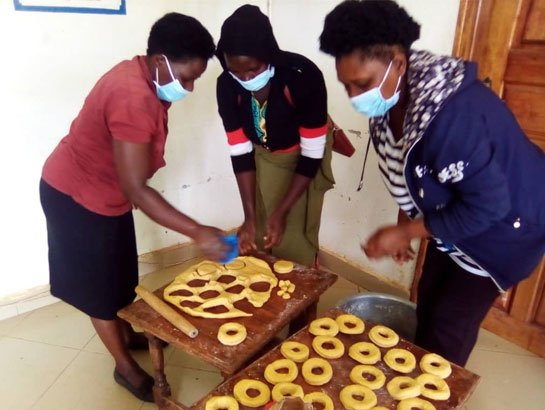 Women in Uganda cooking