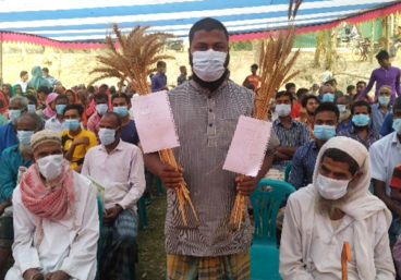 Man in Asia holding zinc wheat