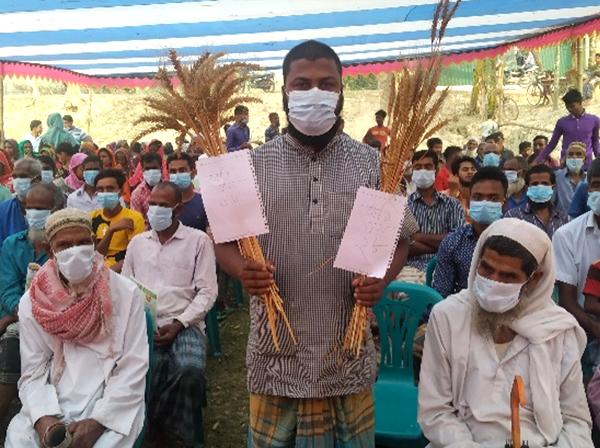 Man in Asia holding zinc wheat